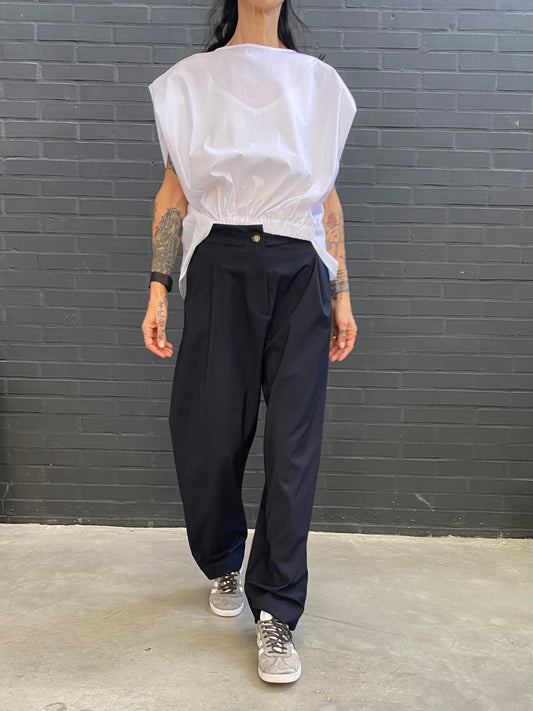 Trousers with pleats