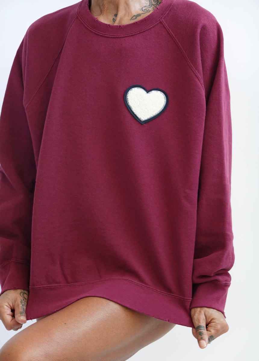 Felpa raglan con patch cuore